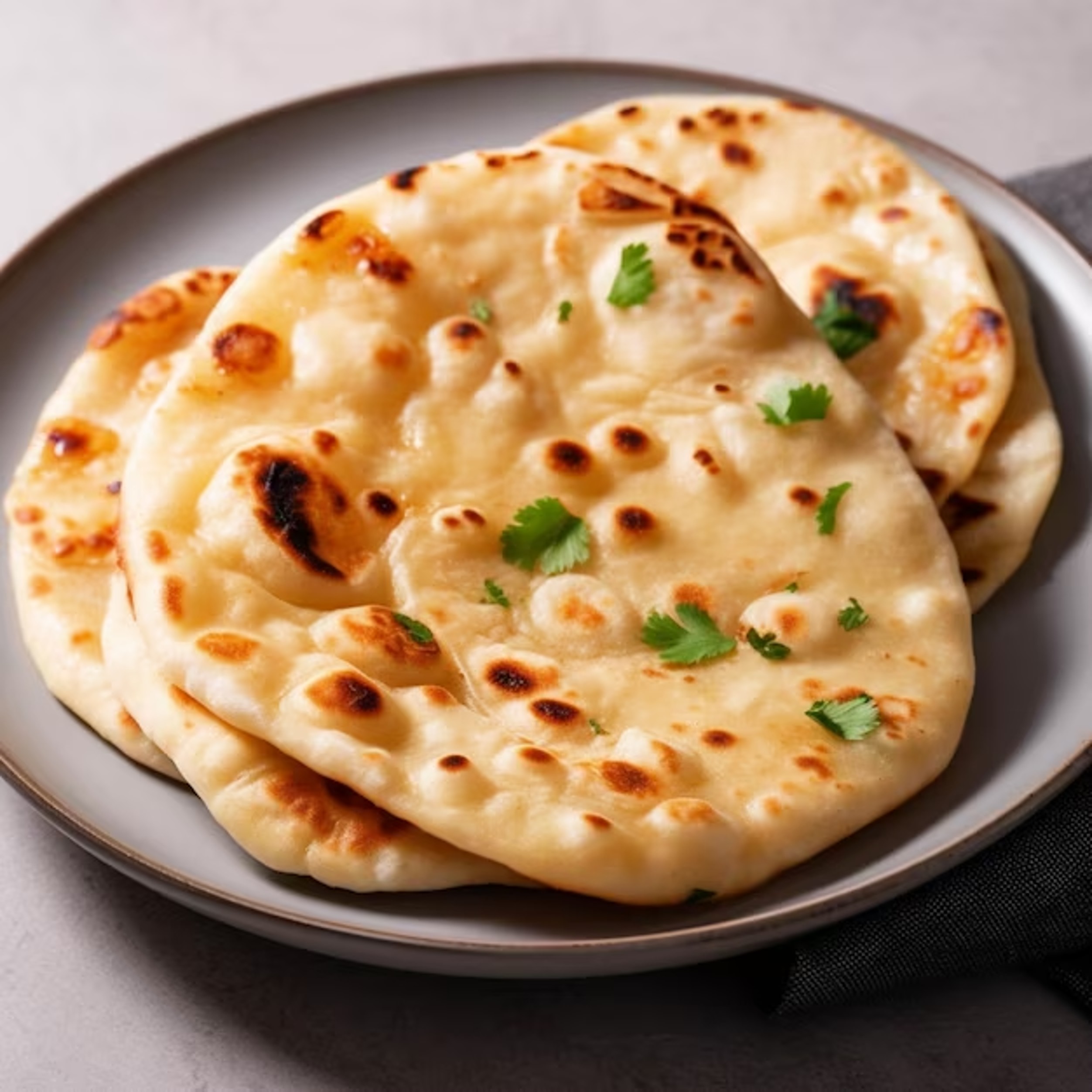 indian naan bread with parsley wooden board selective focus_934652 1799